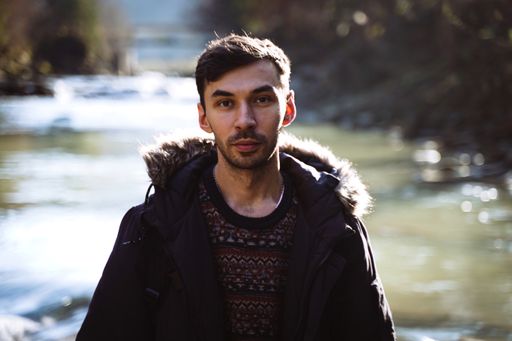 A portrait of a bearded young man from Ukraine