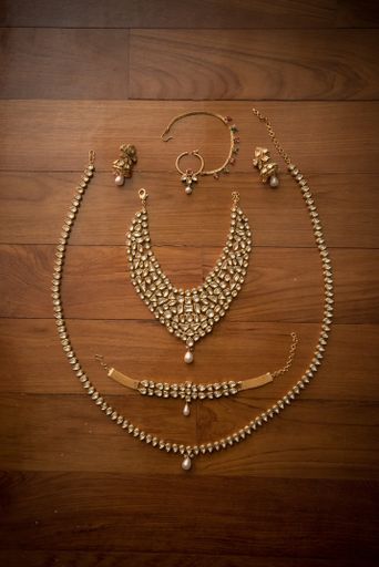 The traditional jewelry set with stones on wooden surface