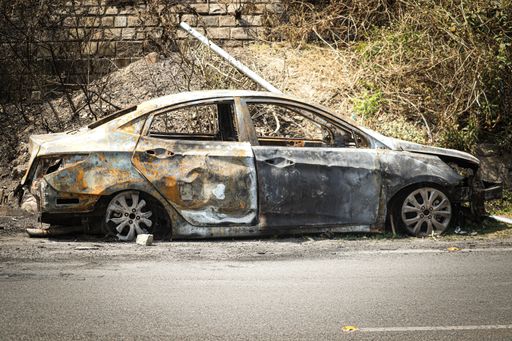A damaged dirty car after a traffic collision
