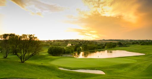 A scenic view of water hazards on a fairway golf course