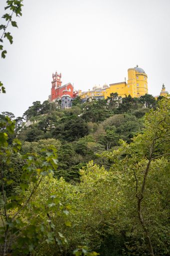A low angle shot of a beautiful building of sintra-cascais natural park in portugal with a white sky in the background