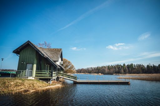 The fisherman house by the lake with boat platform