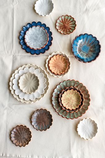 Ceramic scallop plates and bowls in various coloured glazes