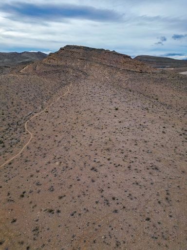 A vertical aerial view of a trail through the deserts of Nevada