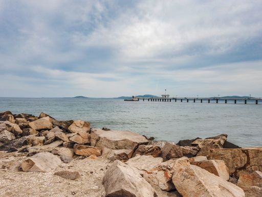 A beautiful view of the Burgas pier from a rocky coast in Bulgaria on a gloomy day