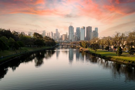 An aerial shot of the cityscape of Melbourne at sunset.