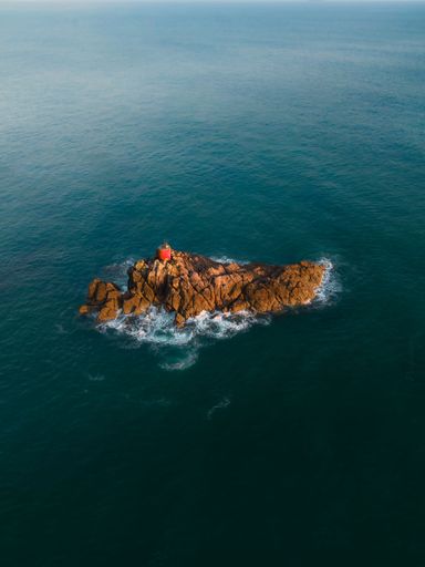 A stunning scene of North Rock on the Mount Maunganui coastline in New Zealand