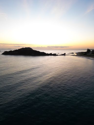 A stunning aerial view of the Mount Maunganui beach in Tauranga, New Zealand