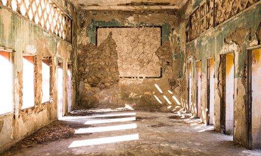 A wide shot of interior an old abandoned destroyed building in a suburban city