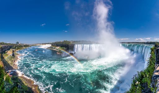 A stunning view of Niagara Falls, with a large waterfall cascading down on a sunny day  Canada
