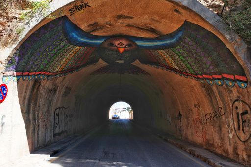 Bloop Art Festival contribution of Bird in Flight street art in Ibiza Town road tunnel