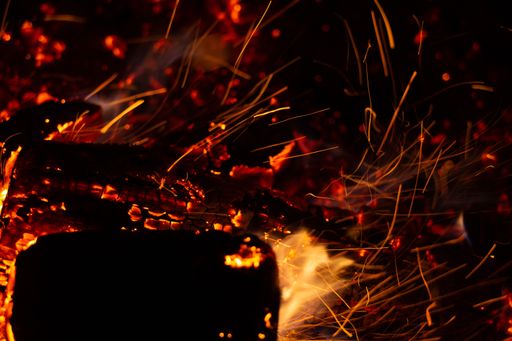 A closeup shot of fire sparks in the dark