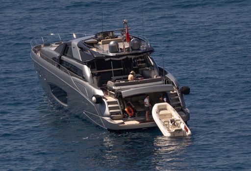 Luxury Yacht 88 Domino Super Riva with tourists on board, anchored in Sorgeto Bay, Ischia, Italy, May 08th 2021