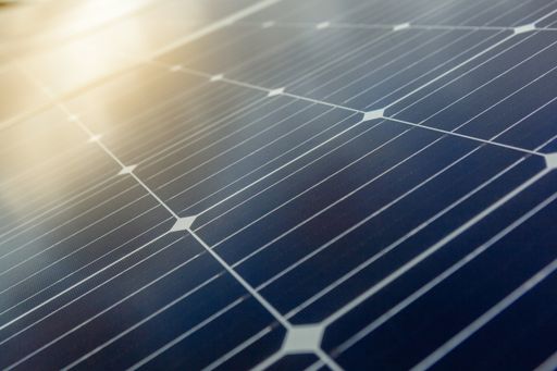 A low angle shot of modern solar panels under the sunlight - environmental concept