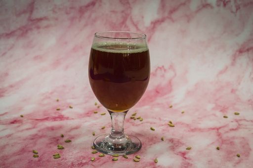 A close-up shot of a glass filled with Craft beer