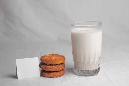cookies and glass of milk on white background food