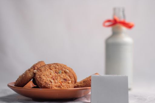 cookies and bottle of milk on white background food