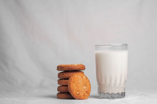 cookies and glass of milk on white background food