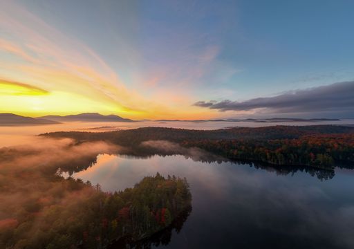 A scenic view of a sunrise over Mason Lake.