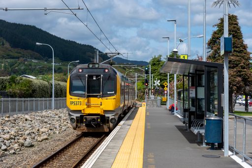 A closeup of a yellow commuter train in Wellington, New Zealand