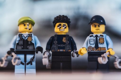 Lego figures of police officers standing together in a group. Concept for police officer and law enforcement