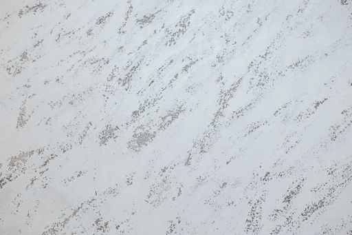 A painted wall background in white and cream colors