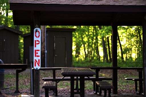 An OPEN sign a a concessions dining area at a nature park