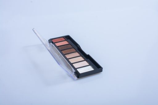 A closeup of a colorful eyeshadow makeup palette isolated on a white background