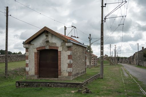Small, old abandoned train station, warehouse for material, tools, ticket sales.