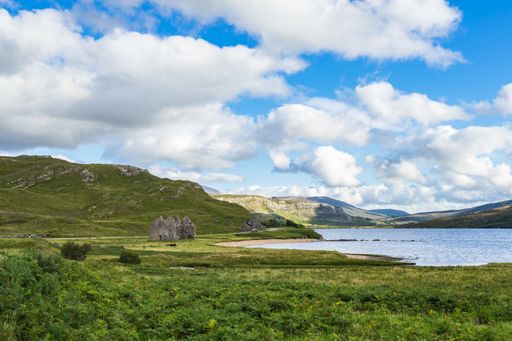 A view of the ruins of Calda House on the shores of Loch Assynt in north west Highlands, Scotland