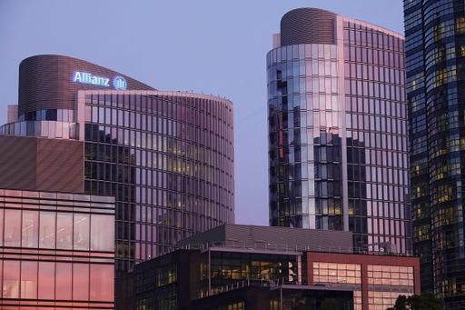 Evening view on the modern round-shaped Allianz insurer Headquarter skyscraper in Brussels north Business center