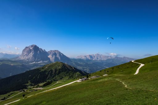 An aerial view of Dolomiti mountain range I under the blue sky in Italy