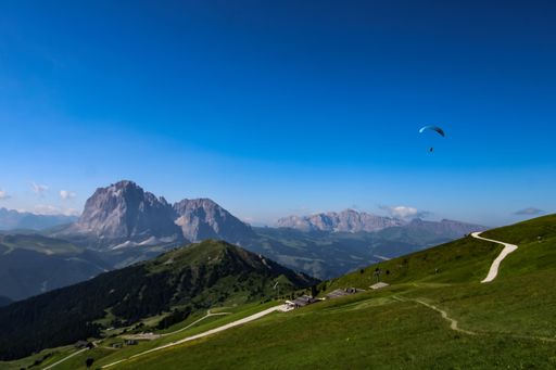 An aerial view of Dolomiti mountain range I under the blue sky in Italy