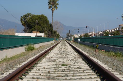 The rusted rails in the railway station during daytime
