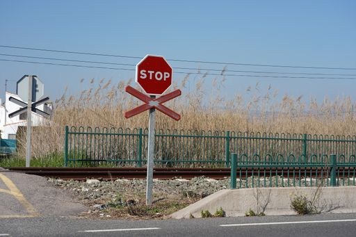A stop warning sign on the rails in the station