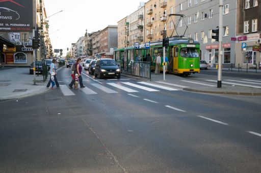 People on the zebra crossing at the busy Glogowska street
