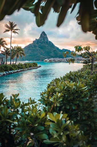 Majestic view of a Bora Bora sunset with a mountain silhouette in the background