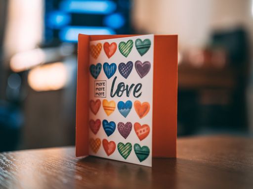 A colorful copybook with hearts and love written on it