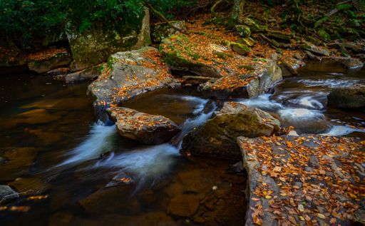 A stunning landscape of Babcock State Park in West Virginia during the fall season