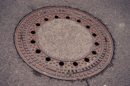 A closeup shot of sewer hatch