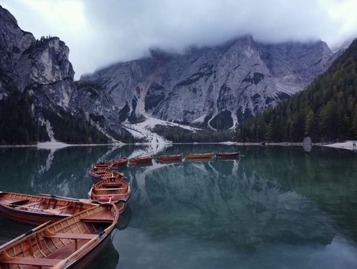 The Wooden boats on the Lago di Braies in South Tyrol, Italy.