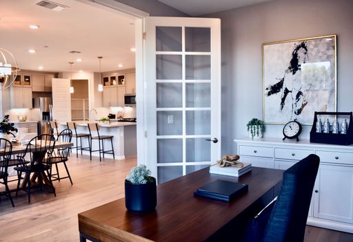 An inviting dining table set in a modern kitchen