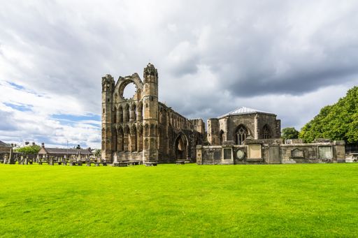 A beautiful scenery of the ruins of Elgin Cathedral, in Scotland under a cloudy sky