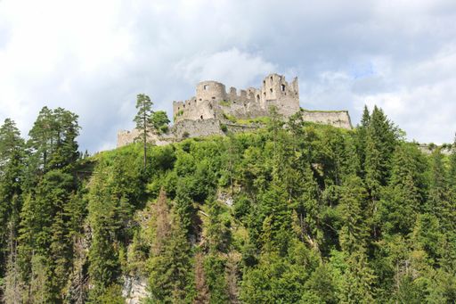 A low angle hsot of historic Ehrenberg Castle in Reutte, Tyrol, Austria under a cloudy sky