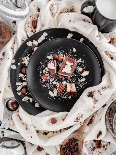 A vertical top view of gourmet cake slices with coconut flakes
