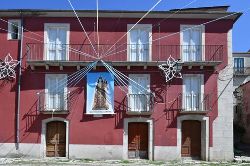 The facade of a house decorated for a religious festival in a medieval village in the province of Campania region.