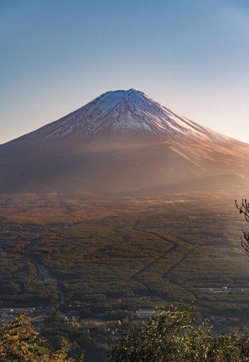 A vertical shot of Japan, Mount Fuji, under the blue sky