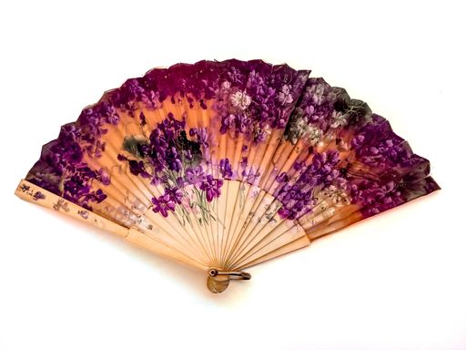 antique Spanish silk folding fan hand painted with artistic colorful floral designs. Ladies used it for cooling by waving it to create an airflow.