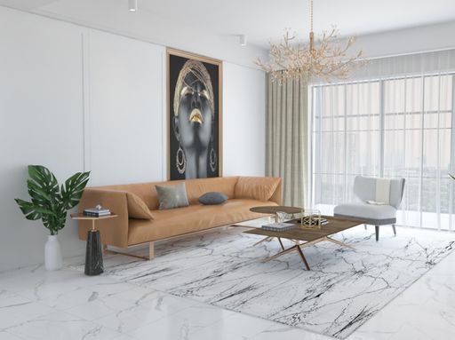Spacious and inviting living room featuring modern orange leather furniture and artwork on the walls