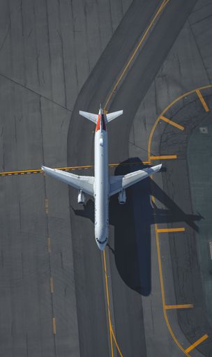 An aerial view of am American Airlines plane taxiing at an airport in Boston